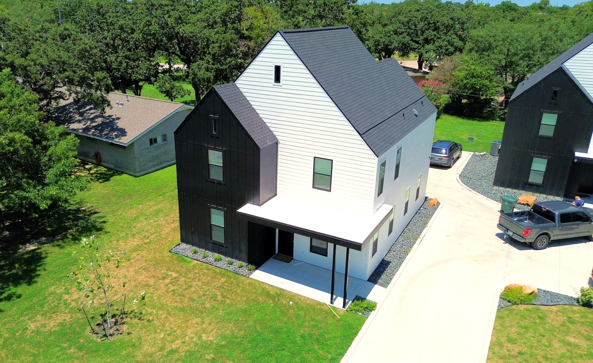 Aerial of a modern black and white student rental property